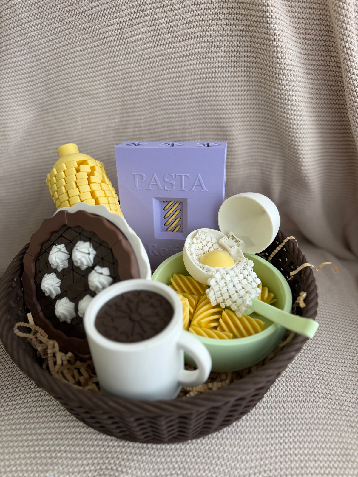 Coffee cup styled in a basket with other pretend-play food, sold separately