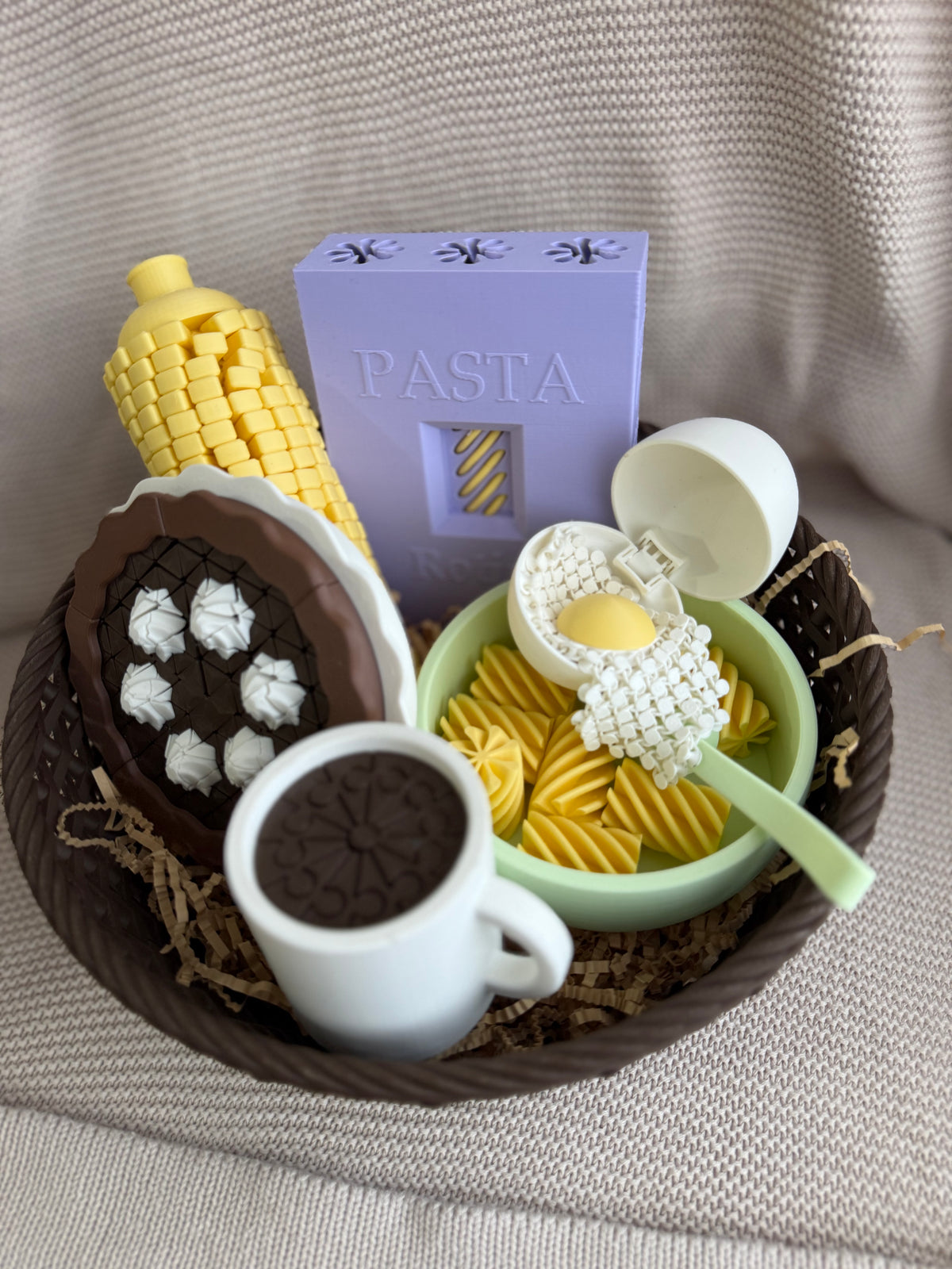 Twisty Corn styled in a basket with other pretend-play food, sold separately